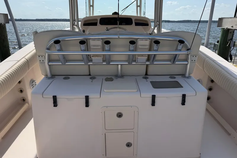 Slide: The Image of 2008 Grady-White Canyon 336 boat interior with rod holders and storage compartments. - 10