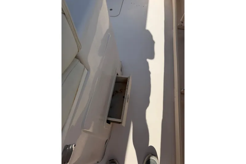 Slide: The Image of 2008 Grady-White Canyon 336 boat interior with open storage compartment. - 13