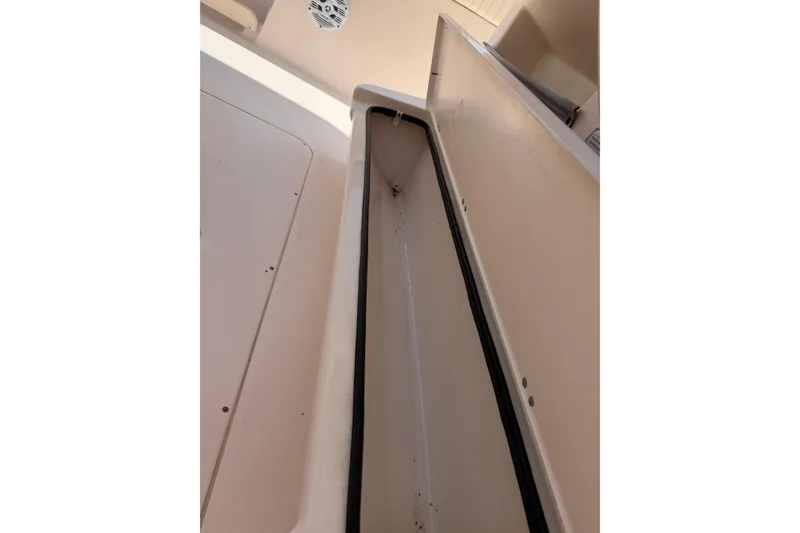 Slide: The Image of Open storage compartment on a 2008 Grady-White Canyon 336 boat. - 15