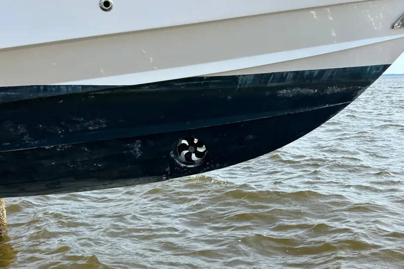 Slide: The Image of 2008 Grady-White Canyon 336 boat hull with bow thruster, above water. - 2