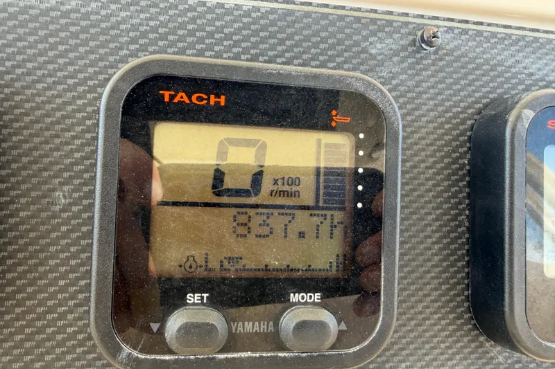 Slide: The Image of Tachometer display on 2008 Grady-White Canyon 336 boat, showing 837.7 hours. - 20
