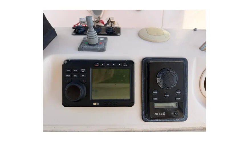 Slide: The Image of Control panel of a 2008 Grady-White Canyon 336 boat with navigation equipment. - 23