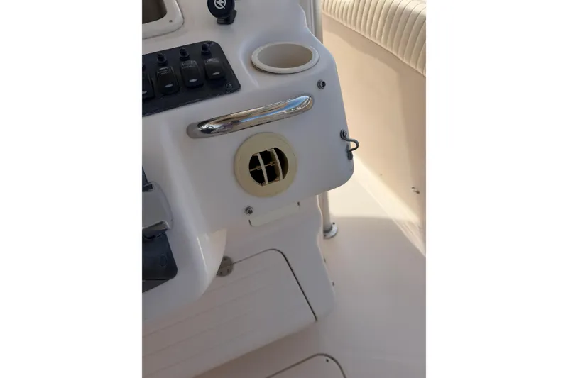Slide: The Image of Control panel of a 2008 Grady-White Canyon 336 boat with cup holder and vent. - 24