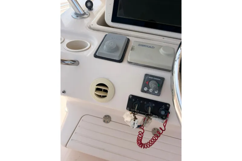 Slide: The Image of Control panel of a 2008 Grady-White Canyon 336 boat with Simrad electronics. - 25