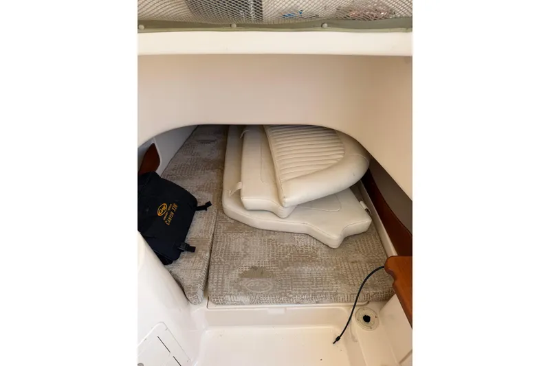 Slide: The Image of 2008 Grady-White Canyon 336 cabin interior with cushions and storage. - 30