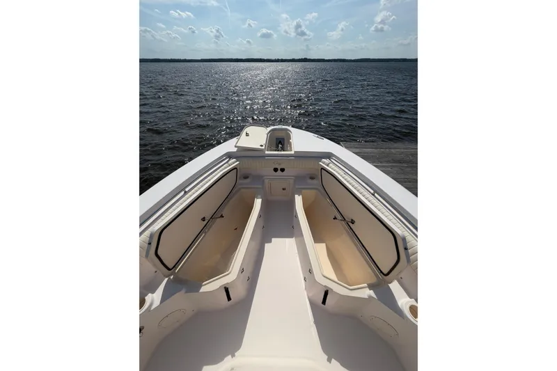 Slide: The Image of 2008 Grady-White Canyon 336 boat interior with open storage, overlooking calm waters. - 33
