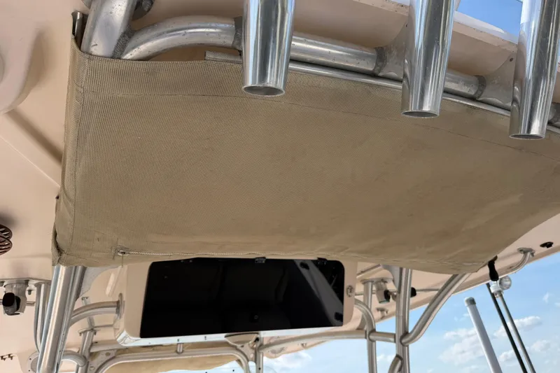 Slide: The Image of 2008 Grady-White Canyon 336 boat interior with rod holders and canvas storage. - 38