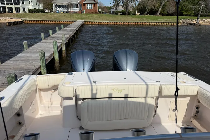 Slide: The Image of 2008 Grady-White Canyon 336 boat docked by a wooden pier on a sunny day. - 4