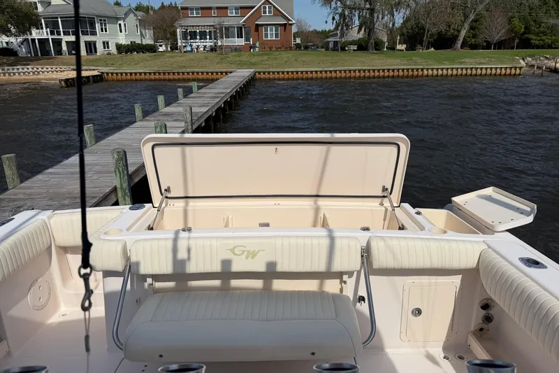 Slide: The Image of 2008 Grady-White Canyon 336 boat docked by waterfront homes. - 5