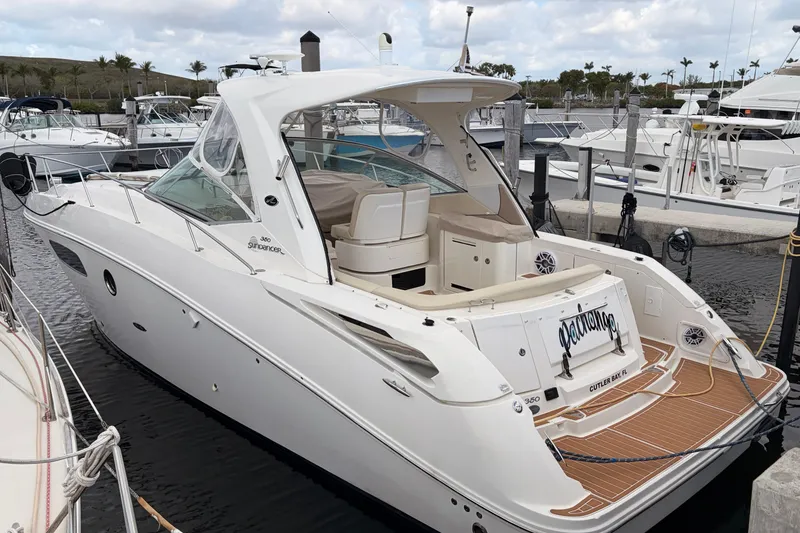 The Image of 2008 Sea Ray Sundancer 350 yacht docked at marina, featuring sleek design and spacious deck. - 0