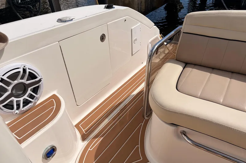 Slide: The Image of 2008 Sea Ray Sundancer 350 boat interior with beige seating and marine speaker. - 13