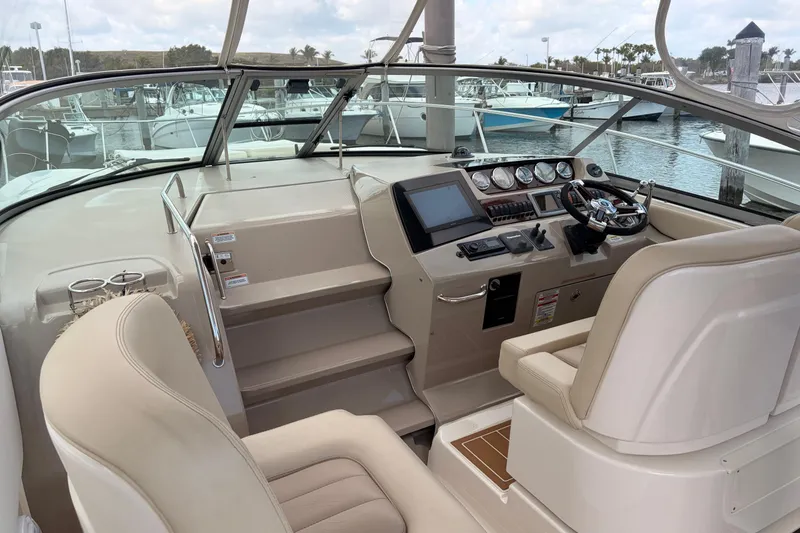 Slide: The Image of Helm of 2008 Sea Ray Sundancer 350 with modern controls and comfortable seating. - 14