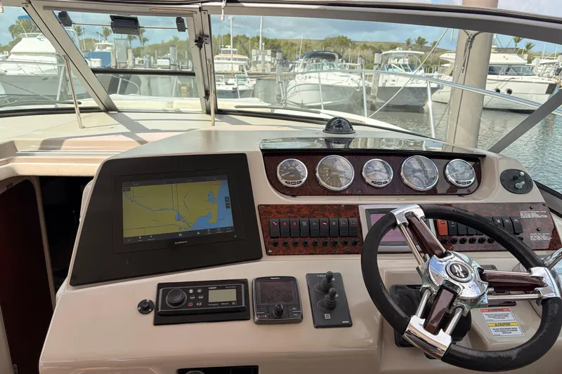 Slide: The Image of Cockpit of 2008 Sea Ray Sundancer 350 with navigation system and steering wheel. - 19
