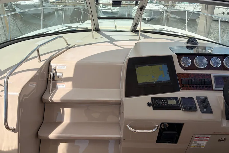 Slide: The Image of 2008 Sea Ray Sundancer 350 helm with navigation system and control panel. - 20