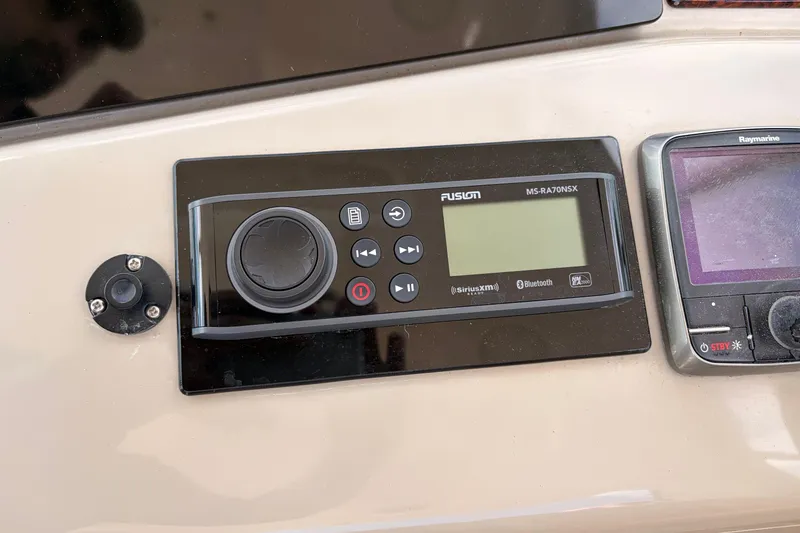 Slide: The Image of Control panel of a 2008 Sea Ray Sundancer 350 with Fusion and Raymarine systems. - 22