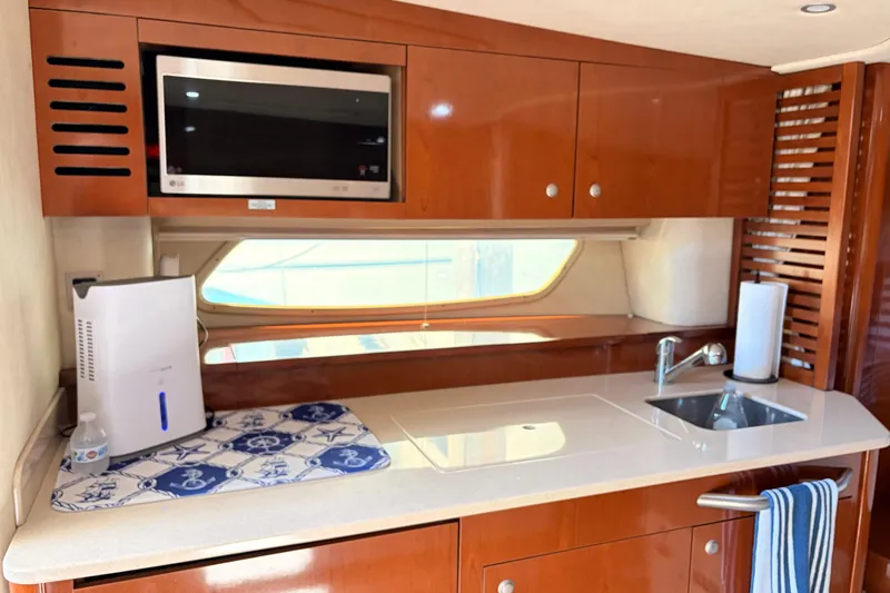 Slide: The Image of Luxurious kitchen area in 2008 Sea Ray Sundancer 350 yacht with modern amenities. - 24