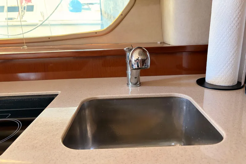 Slide: The Image of Kitchen sink area in 2008 Sea Ray Sundancer 350 yacht, featuring modern faucet and countertop. - 33