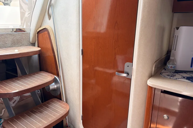 Slide: The Image of Interior of 2008 Sea Ray Sundancer 350 with wooden stairs and door. - 35