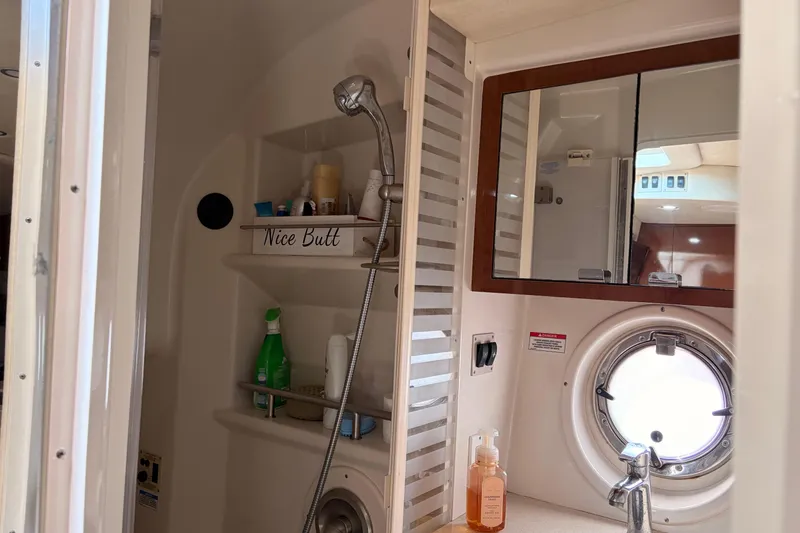 Slide: The Image of Bathroom interior of 2008 Sea Ray Sundancer 350 yacht with shower and porthole window. - 38
