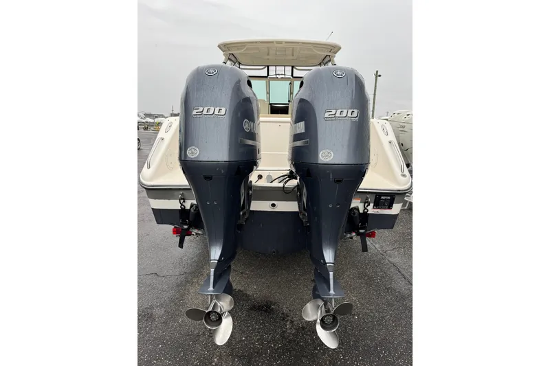 Slide: The Image of 2016 Pursuit DC 265 Dual Console with twin Yamaha 200 engines, rear view. - 10