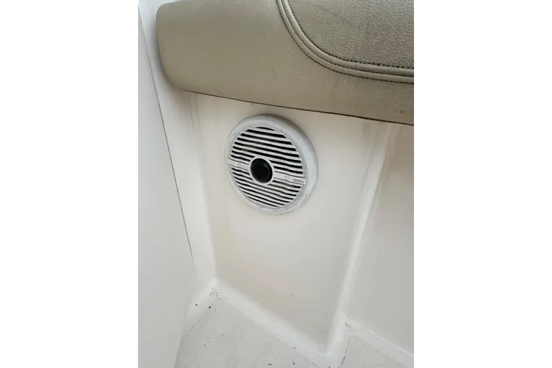 Slide: The Image of Speaker on 2016 Pursuit DC 265 Dual Console boat interior. - 23