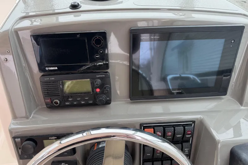 Slide: The Image of Dashboard of 2016 Pursuit DC 265 Dual Console with Yamaha and Garmin electronics. - 38