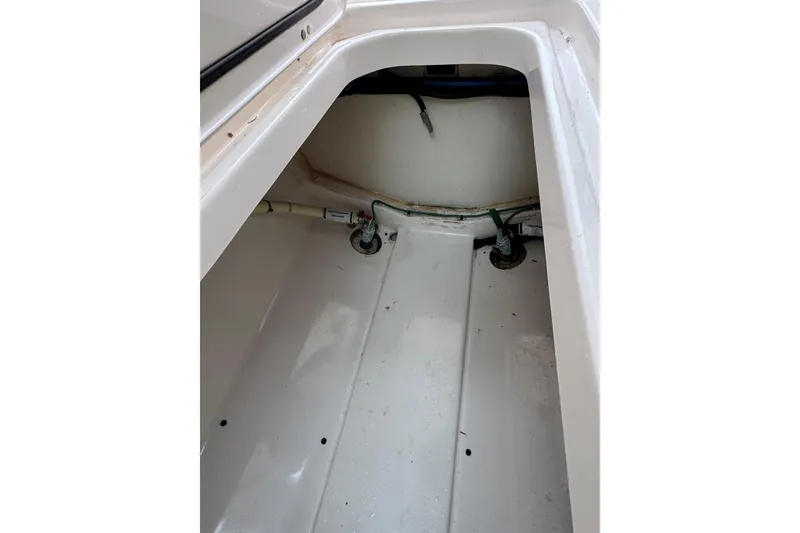 Slide: The Image of Interior view of a 2016 Pursuit DC 265 Dual Console boat compartment. - 43