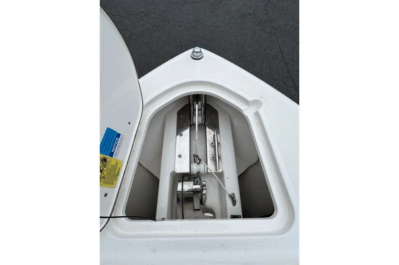 Slide: The Image of Anchor compartment of 2016 Pursuit DC 265 Dual Console boat, open and visible. - 47