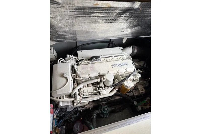 Slide: The Image of Engine of a 1997 Sea Ray 400 Sedan Bridge boat, showcasing detailed components. - 15