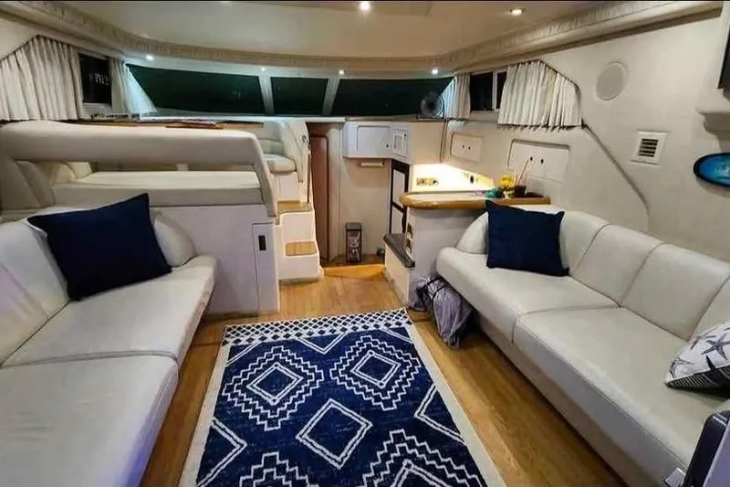 Slide: The Image of Luxurious interior of a 1997 Sea Ray 400 Sedan Bridge yacht with elegant seating. - 2
