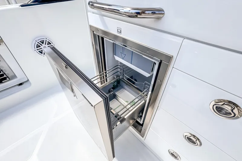 Slide: The Image of Stainless steel drawer on 2026 Wellcraft 28 T-Top boat, open with visible interior. - 9