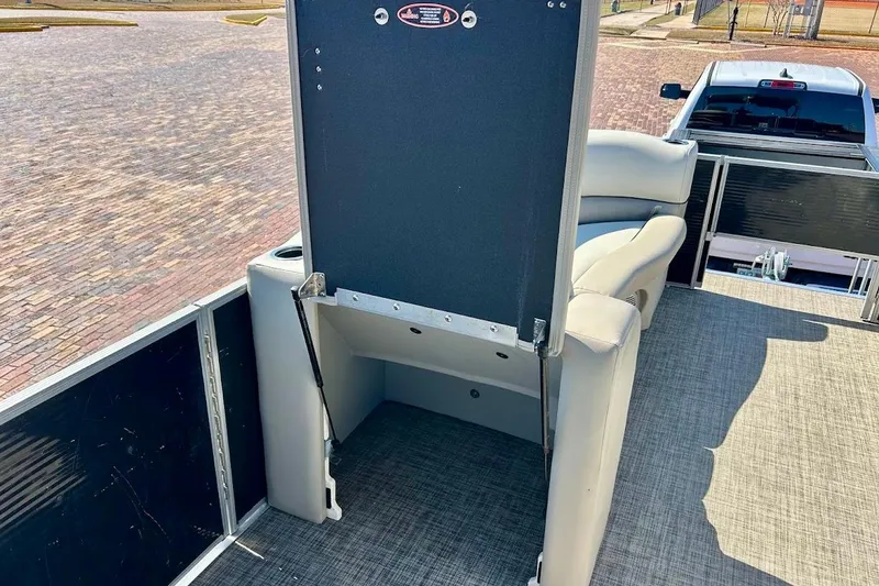Slide: The Image of 2023 Cypress Cay Seabreeze 232 pontoon boat interior with seating and storage compartment. - 20