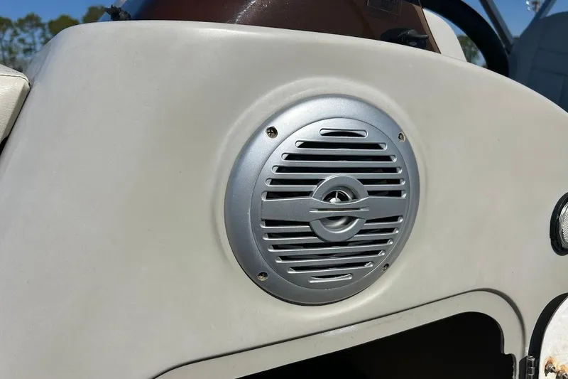 Slide: The Image of Speaker on 2023 Cypress Cay Seabreeze 232 boat dashboard, close-up view. - 22