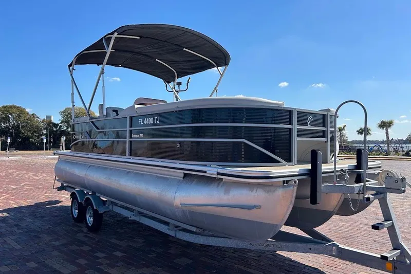 Slide: The Image of 2023 Cypress Cay Seabreeze 232 pontoon boat on trailer, sunny day. - 6