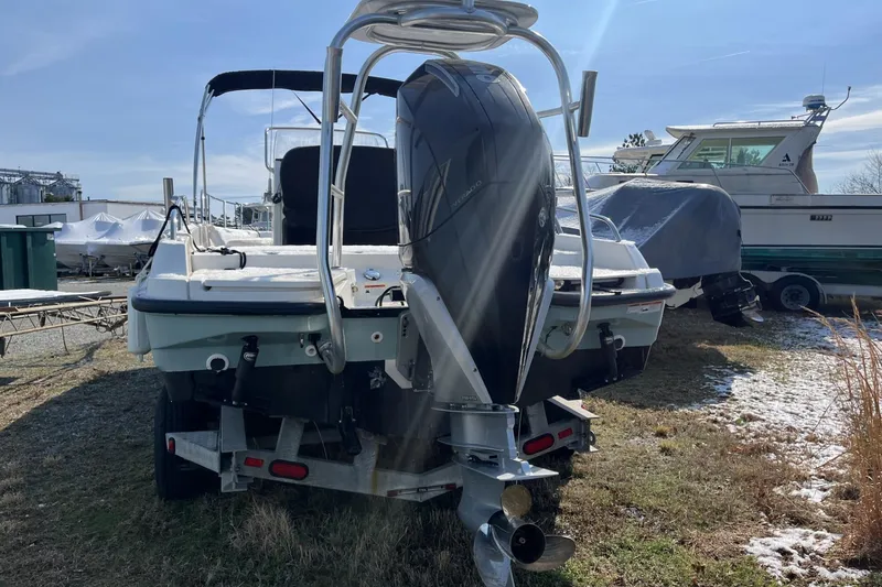 Slide: The Image of 2019 Boston Whaler 240 Dauntless boat with outboard motor on trailer. - 17