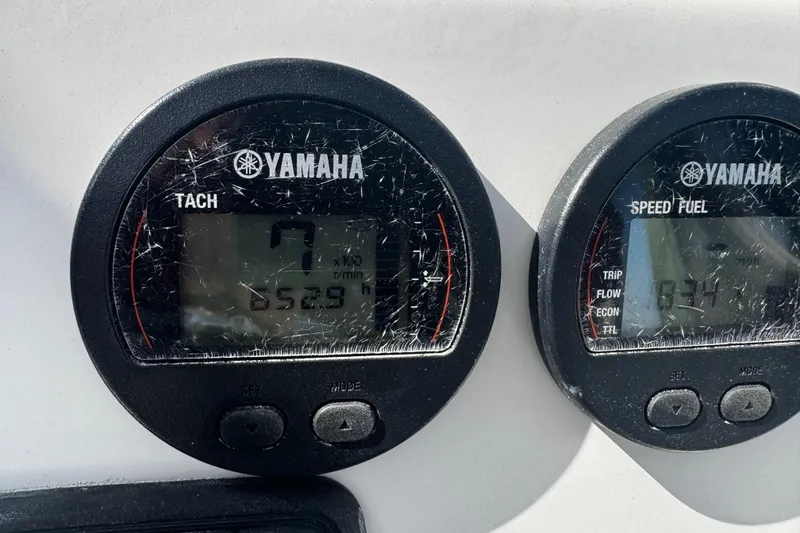 Slide: The Image of Yamaha tachometer and speed fuel gauges on a 2015 Robalo 226 Cayman boat. - 25