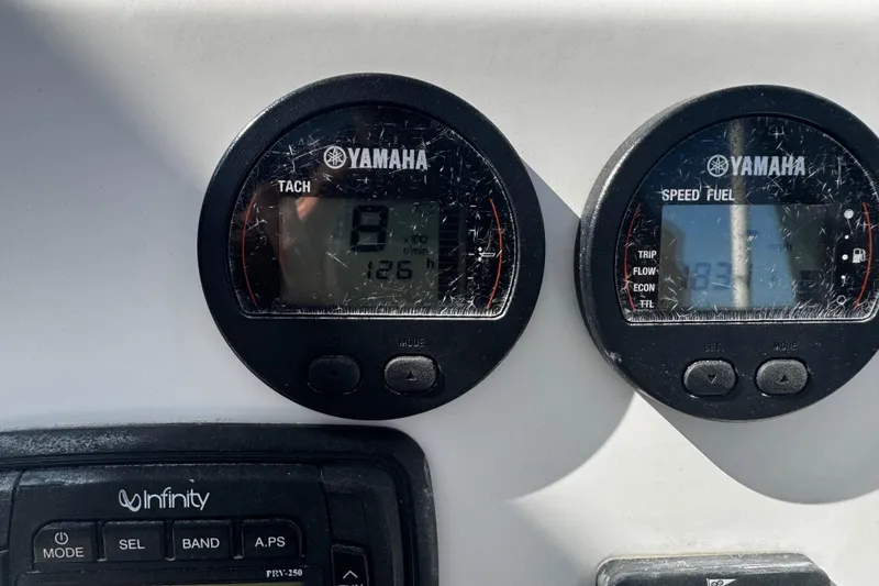 Slide: The Image of Close-up of Yamaha tachometer and speed fuel gauges on 2015 Robalo 226 Cayman boat. - 26