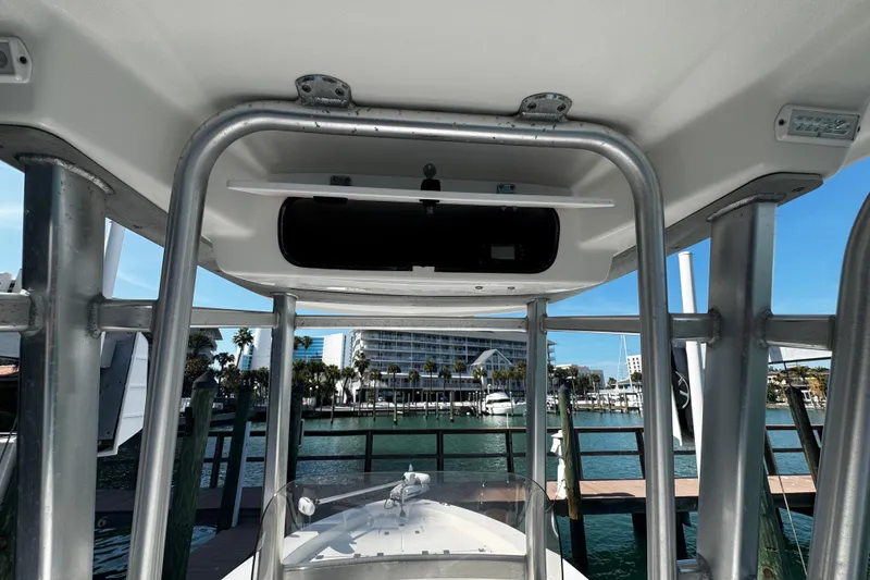 Slide: The Image of 2015 Robalo 226 Cayman boat interior with marina view in the background. - 30