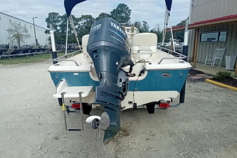 Slide: The Image of 2007 Key West 196 Bay Reef boat with Yamaha outboard motor, parked outdoors. - 11