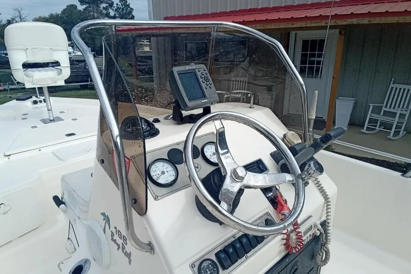 Slide: The Image of 2007 Key West 196 Bay Reef boat console with steering wheel and navigation equipment. - 13