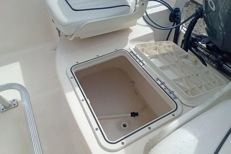 Slide: The Image of Open storage compartment on a 2007 Key West 196 Bay Reef boat. - 15