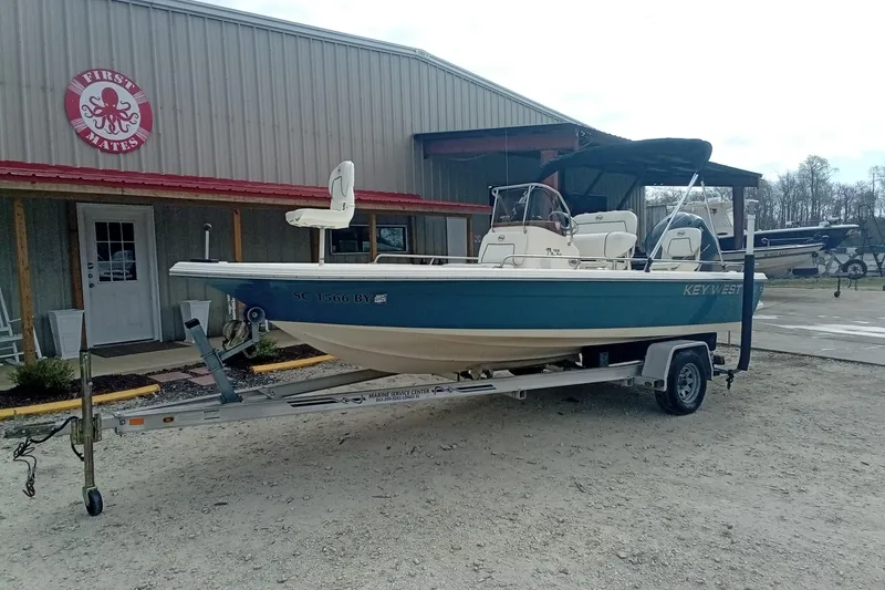 Slide: The Image of 2007 Key West 196 Bay Reef boat on trailer outside First Mates building. - 3
