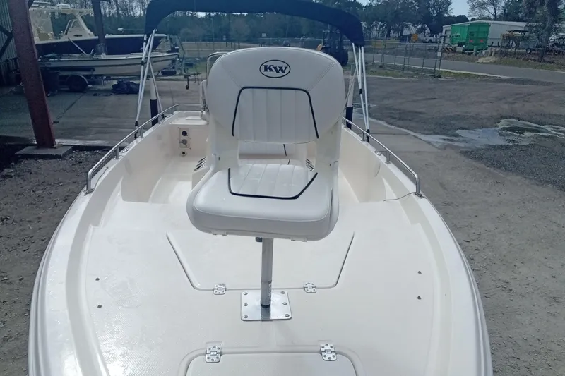 Slide: The Image of 2007 Key West 196 Bay Reef boat with white seating and open deck. - 5