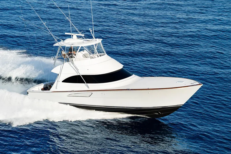 Slide: The Image of 2026 Viking 50 Convertible yacht cruising on open ocean waters. - 2