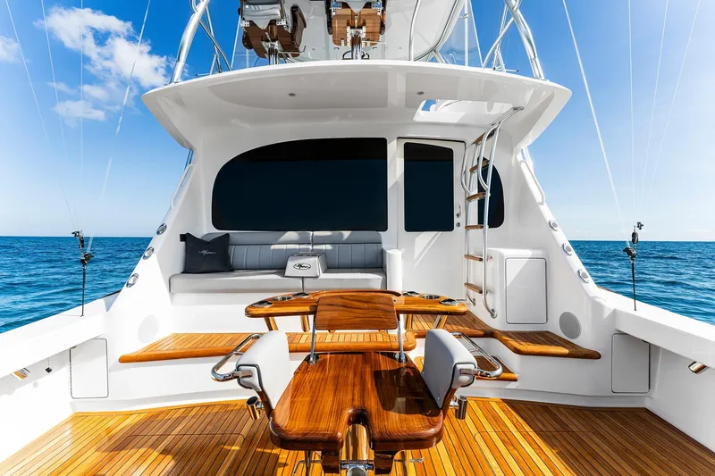 Slide: The Image of 2026 Viking 50 Convertible yacht with sleek deck design and ocean backdrop. - 19
