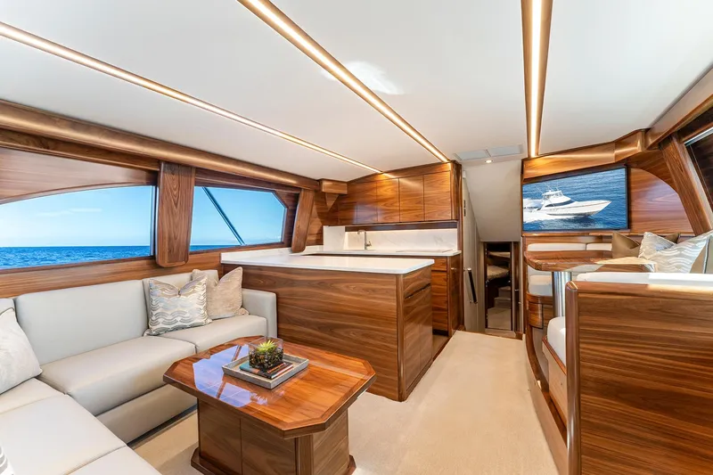 Slide: The Image of Luxurious interior of 2026 Viking 50 Convertible yacht with elegant wood finishes and ocean view. - 7