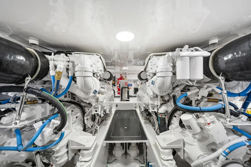 Slide: The Image of Engine room of 2026 Viking 50 Convertible yacht, showcasing advanced machinery and piping. - 18