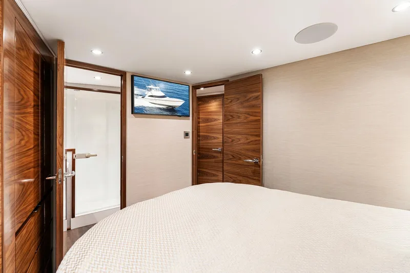 Slide: The Image of Luxurious cabin interior of 2026 Viking 50 Convertible yacht with wood accents and modern amenities. - 13