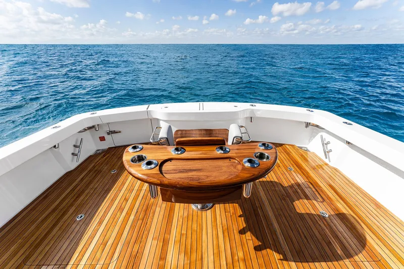 Slide: The Image of Luxurious 2026 Viking 50 Convertible yacht deck with ocean view and elegant wood finish. - 20