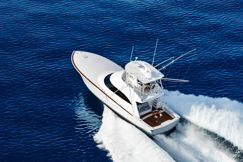 Slide: The Image of 2026 Viking 50 Convertible yacht cruising on open blue sea. - 22